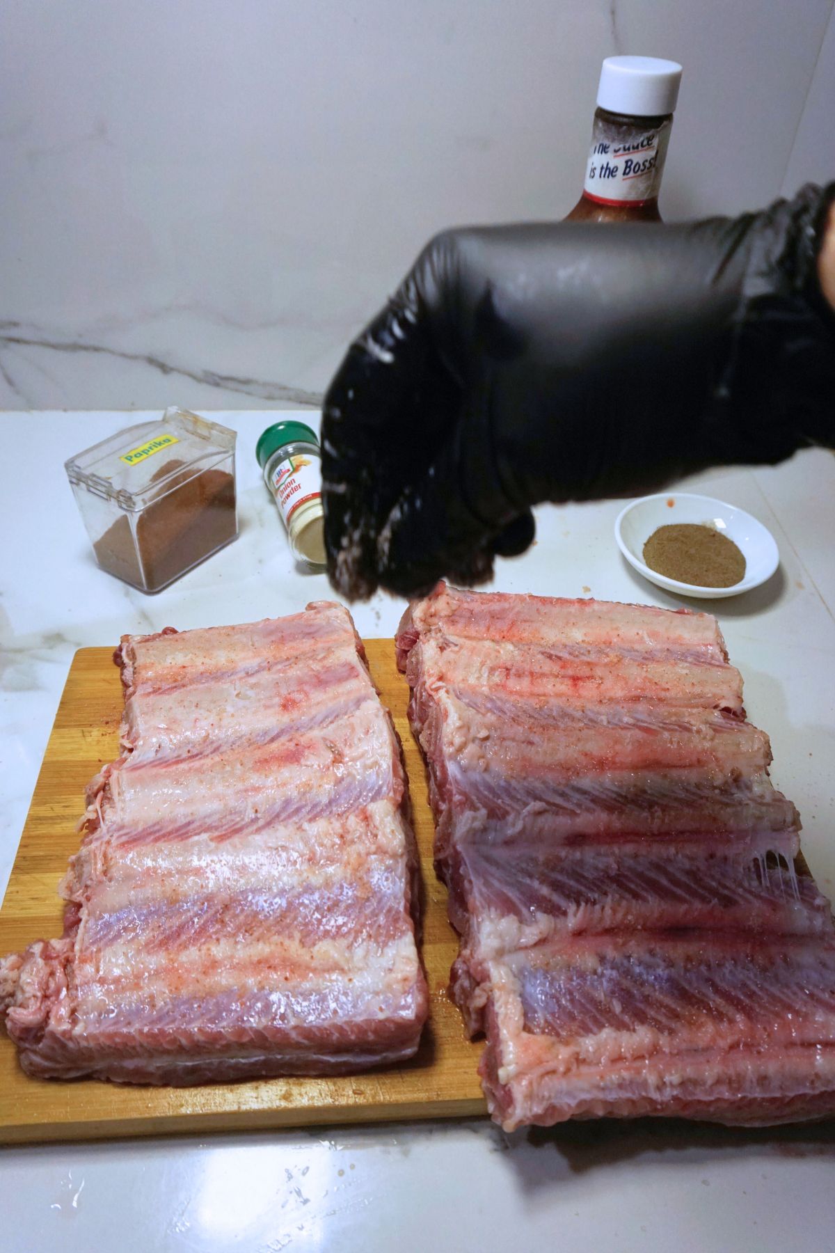 Spare ribs slab seasoned with pepper.