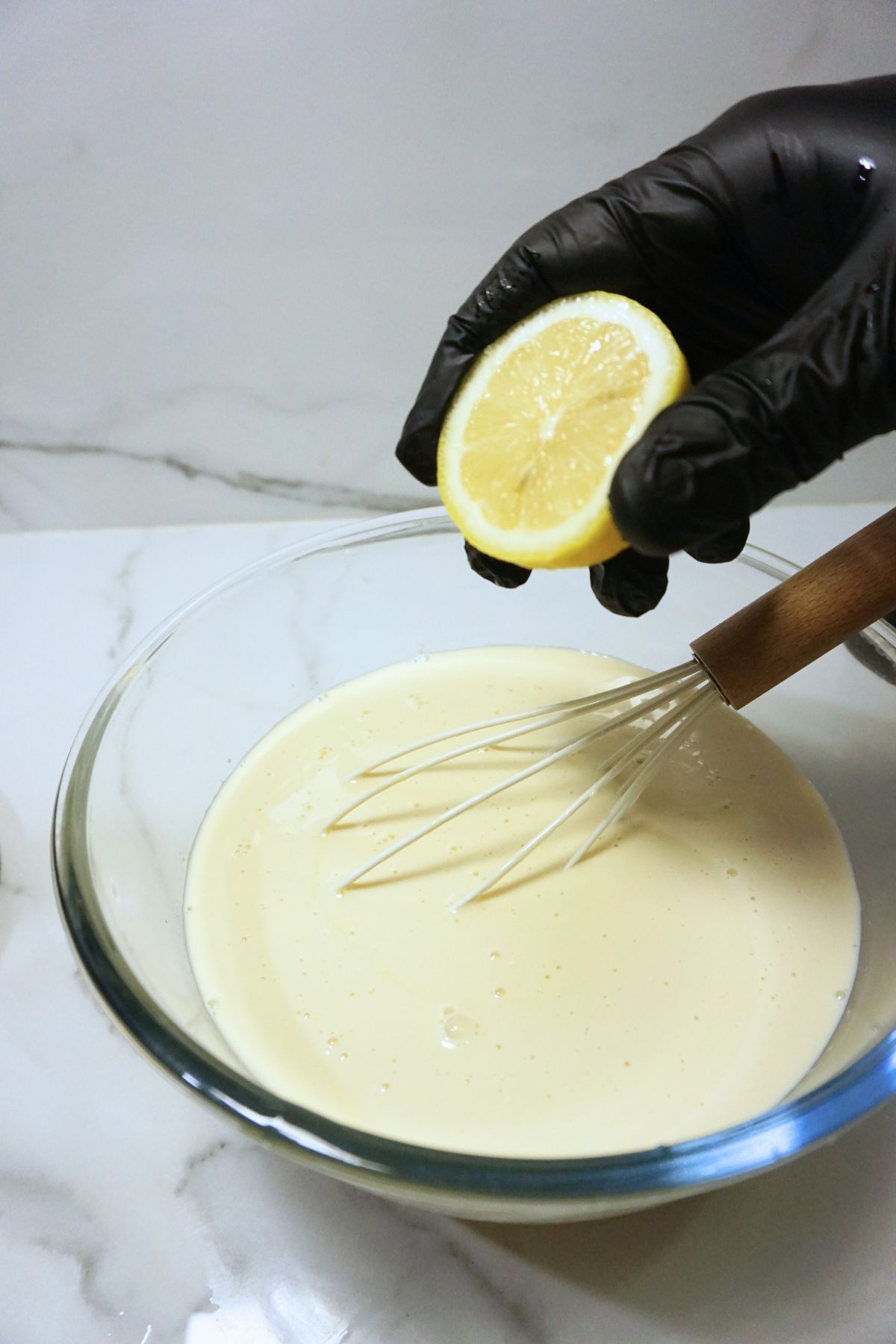 Lemon squeeze added to leche flan mixture.