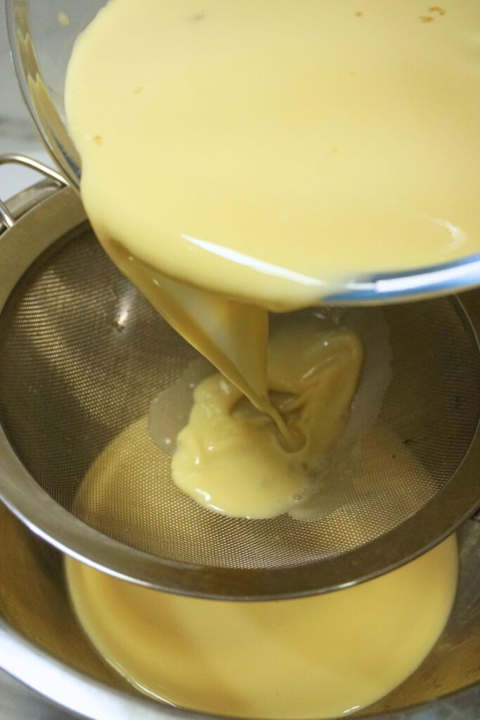 Straining leche flan mixture