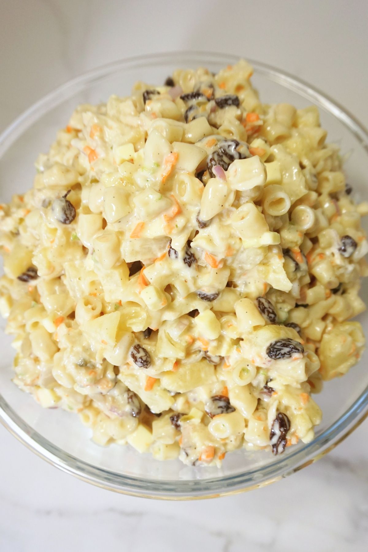 Macaroni salad in a clear bowl