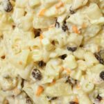 Macaroni salad serving in a white plate