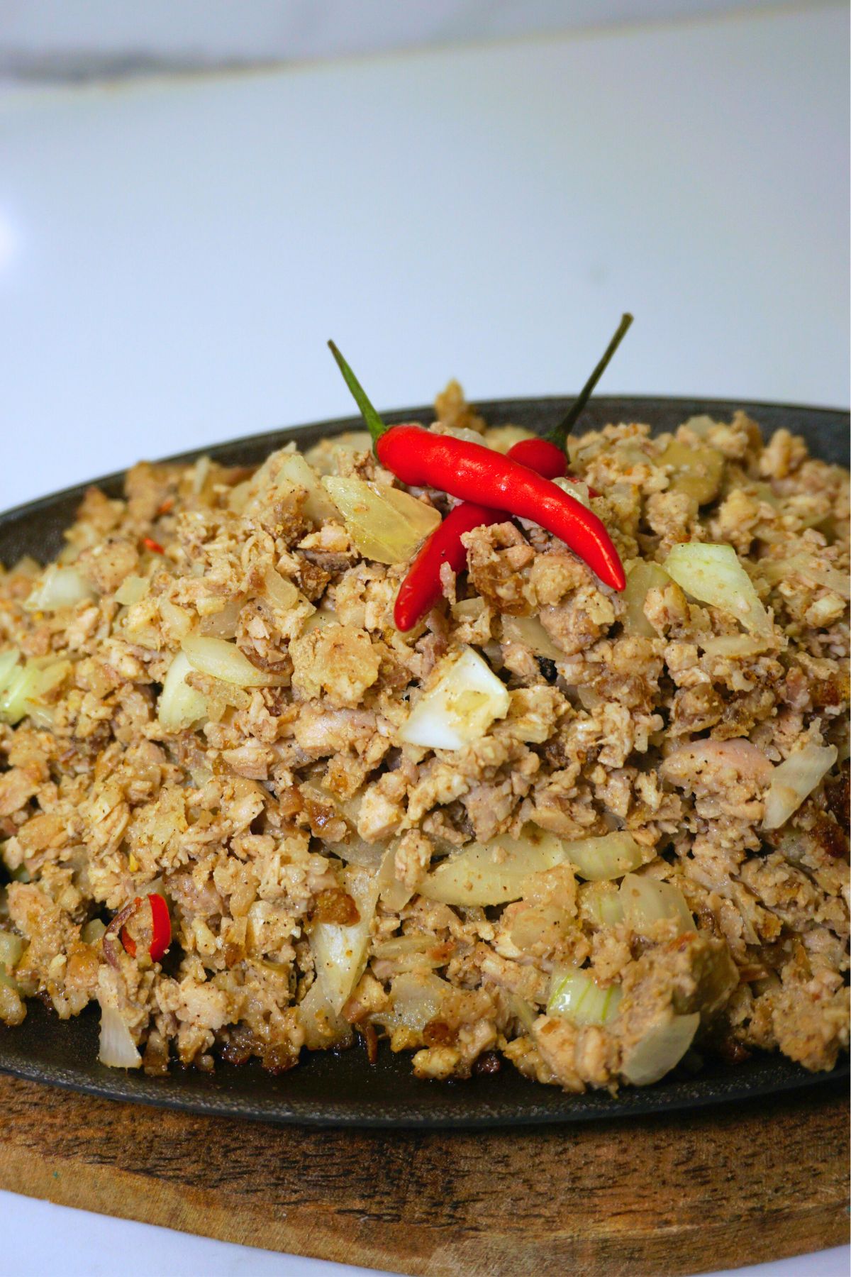 Pork sisig served in a sizzling plate