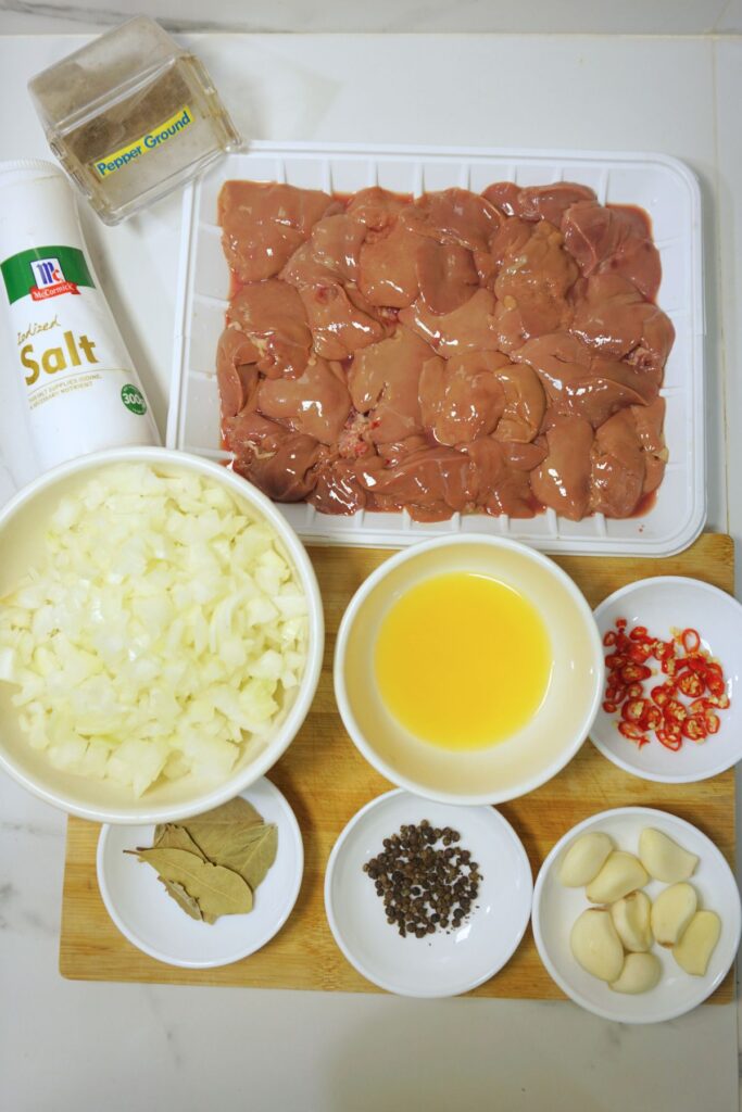 White onions, chicken liver, calamansi,chli, pepper,onion, pork sisig ingredients