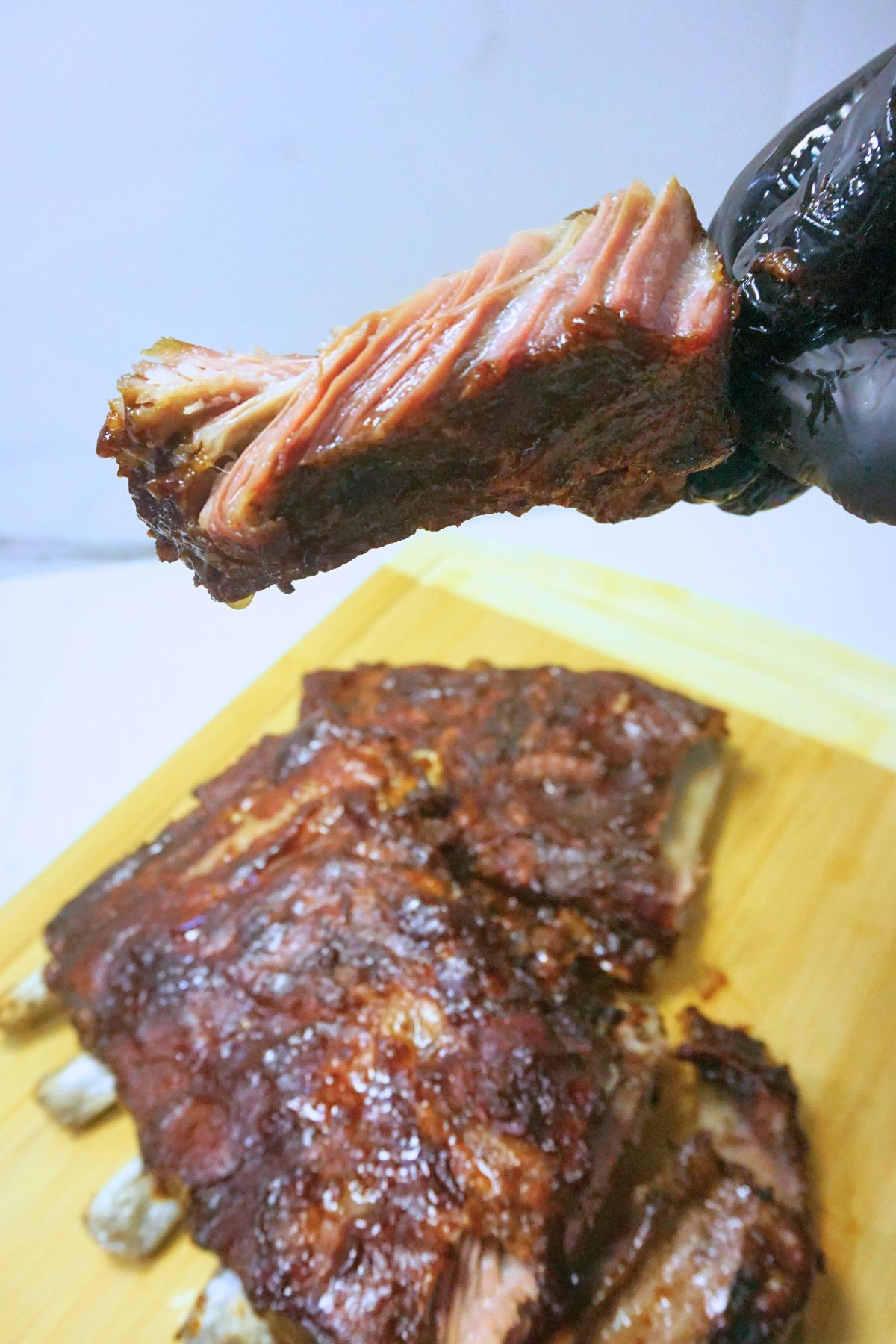 Meat from baked bbq spare ribs